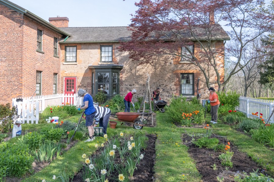Members of the Garden Club of Niagara prepare the flower beds at the McFarland House, on May 12. (Dave Van de Laar)    