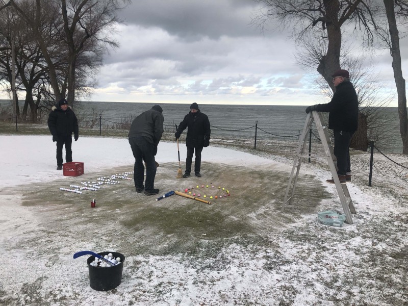 Paul Jacot does his Roman Polanski imitation, directing Ken Porter, Larry Mantle and John Kozik as they create a golf-themed 70th birthday greeting for Don Cruikshank. They swept off the putting green at the NOTL Golf Club to prepare the set for their "show." (Kevin MacLean photo)