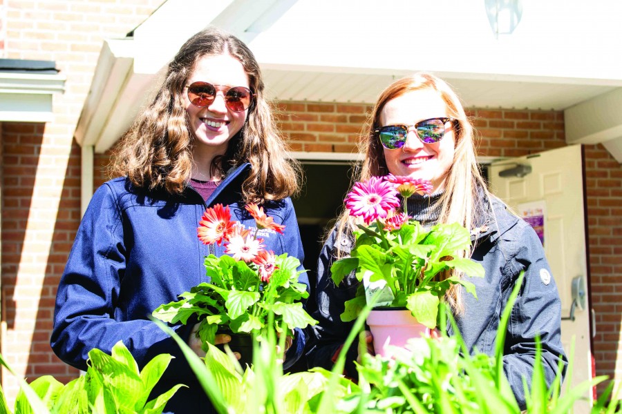 Mattison Innis and Leslie Hockley, first-year Niagara Parks School of Horticulture students, at the St. Mark’ spring garden sale Saturday. (Richard Harley/Niagara Now)