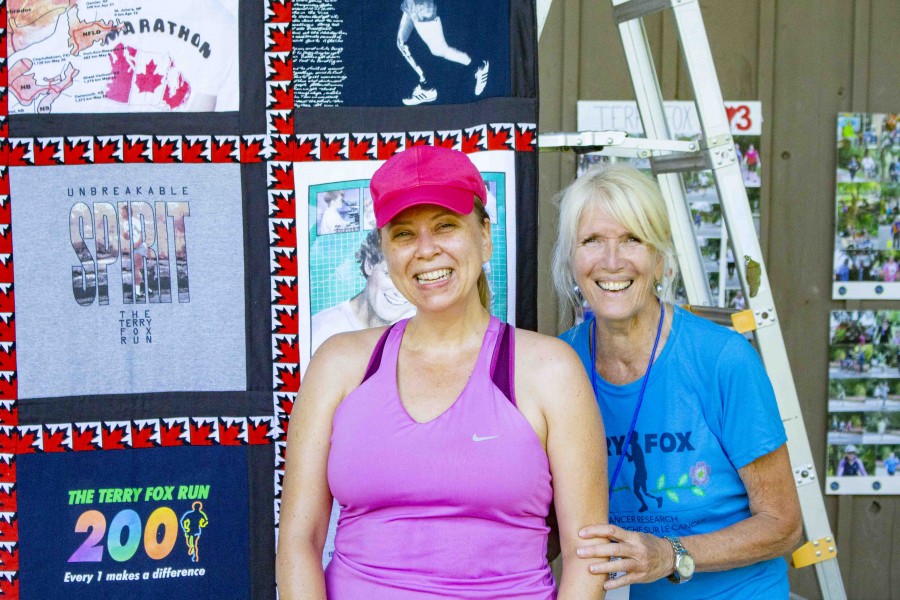 Heidi Sobol and Joan King in front of a quilt made by Lee Bishop. King was Sobol's Grade 4 teacher at Cardinal Newman Catholic Elementary School and hadn't seen her since the 1980's. (Evan Saunders)